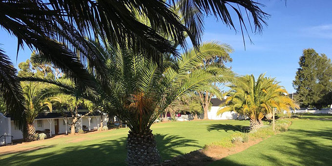 View of the lawn outside the Lord Milner Hotel